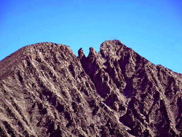 Montana's Crazy Peak in summer: bare rough crags.