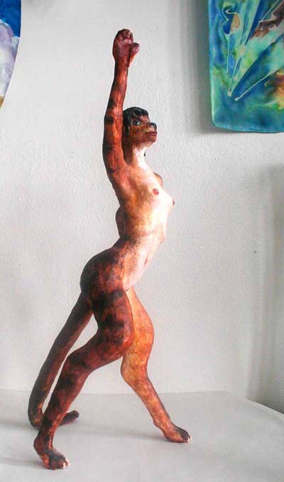 Statue of cat dancer from side. Click to enlarge.