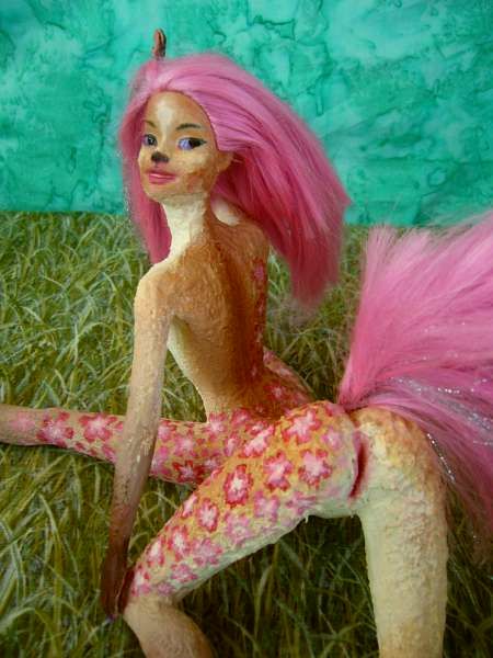 Barbie sculpture illustrating a dream by Chris Wayan: a gracile centauroid dancer, Fuchsia, raising her pink tail.