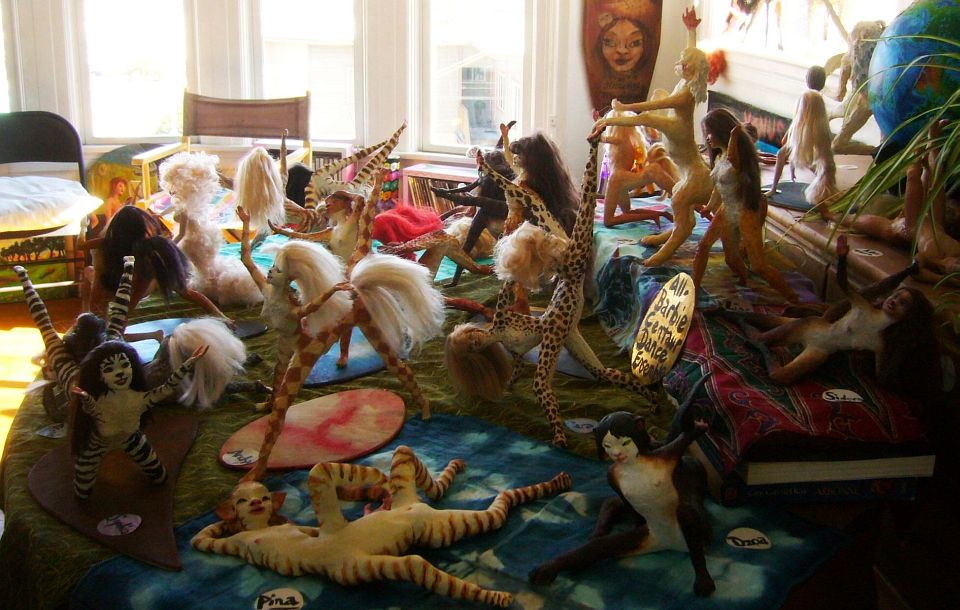 Table covered with figurines by Wayan: the All Barbie Centaur Dance Ensemble.