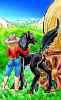 Black mare and cowgirl by wagon in a mountain valley