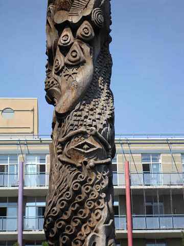 Detail of a dream-inspired totem pole on the Toronto waterfont by Georganna Malloff, showing people and whales. Click to enlarge.