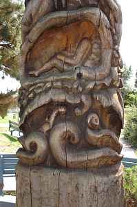Detail of a dream-inspired totem pole on the Toronto waterfont by Georganna Malloff, showing a human in a clamshell. Click to enlarge.