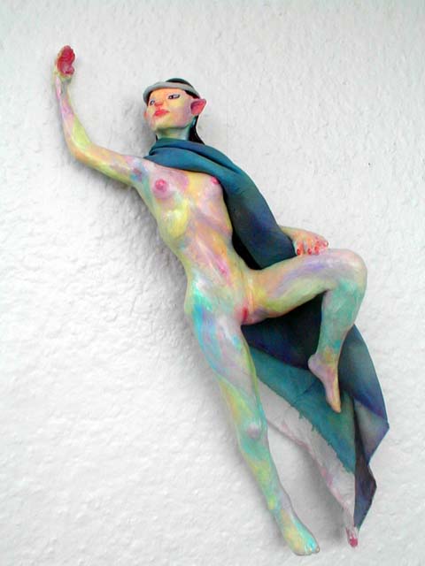 An Elven dancer leaping, in blue cloak; a hanging sculpture. Click to enlarge.