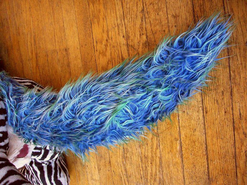 Unicorn tail of blue fake-fur, my first sewing project. Detail of dream sculpture by Wayan.