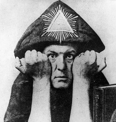 Aleister Crowley in a silly wizard hat.