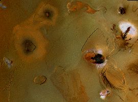 Ashy paterae like cigarette burns near Io's south pole