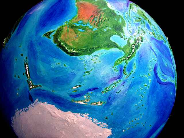 Orbital photo of the arc of cool-temperate islands from New Zealand to Hawaii on an alternate Earth called Jaredia. Click to enlarge.