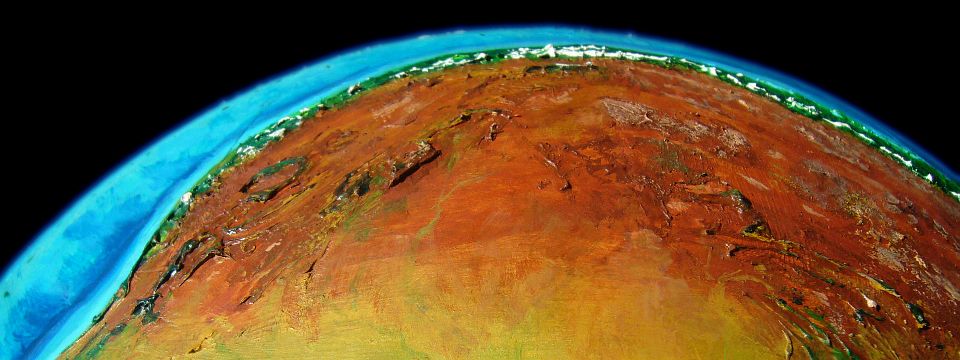 Orbital shot of the desert and narrow green northern coastal strip of Ara, a huge desert continent on Kakalea, a model of an Earthlike world full of Australias.