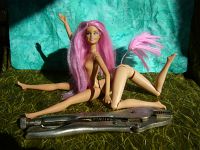 The sculpting of Fuchsia, a centauroid dancer, out of two Barbies; by Chris Wayan. Click to enlarge