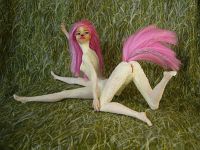 The sculpting of Fuchsia, a centauroid dancer, out of two Barbies; by Chris Wayan. Click to enlarge