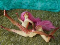 The sculpting of Fuchsia, a centauroid dancer, out of two Barbies; by Chris Wayan. Click to enlarge