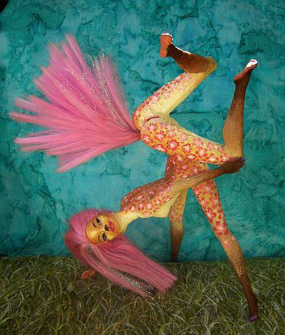 Sculpture of glued Barbies titled 'Fuchsia': a centauroid dancer in floral bodypaint doing a handstand; a native of Kakalea, a model of an Earthlike world full of Australias. Click to enlarge