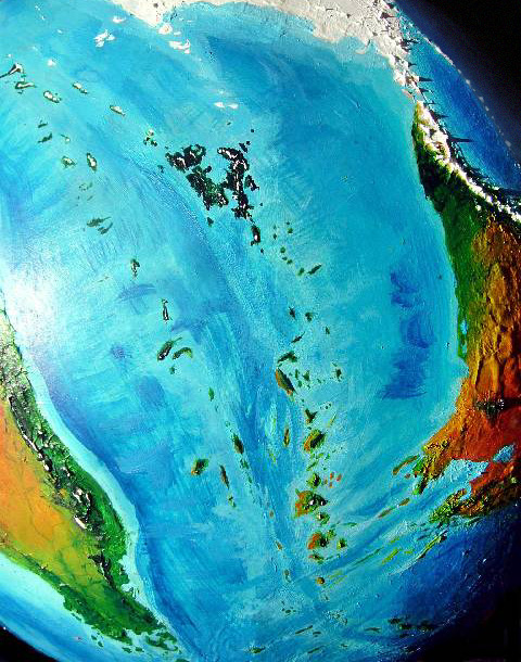 Orbital photo of the islands of the Ibari Sea west of Iba, a desert continent on Kakalea, an unlucky Earthlike world: blue seas, red dry continents.