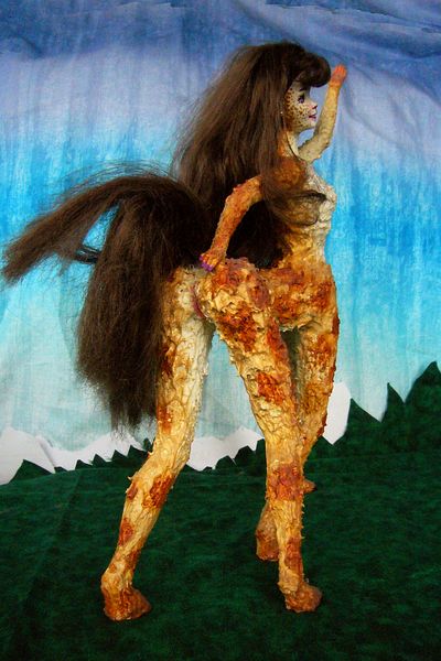 Sculpture of glued Barbies titled 'Lia': a shaggy centauroid cabaret singer on Kakalea, a model of an Earthlike world full of Australias. Click to enlarge