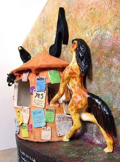 clay statue of the Moral Kiosk papered with moral commandments. On the right, in the form of a slender spotted mare with black mane and tail, I rear up to sing to the Reading Man inside the Kiosk, as two ravens peer in.