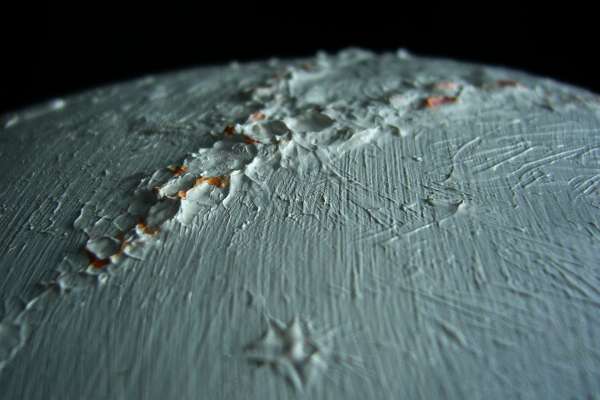 Low orbital photo of Oro Kiru Crater, foreground (blurry) and the Lopi Highlands, the largest icecap on Libratia, a tidelocked world.