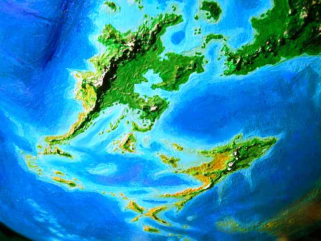 Orbital photo of T'kela and Kilnu, two large islands on Lyr, a world-building experiment.