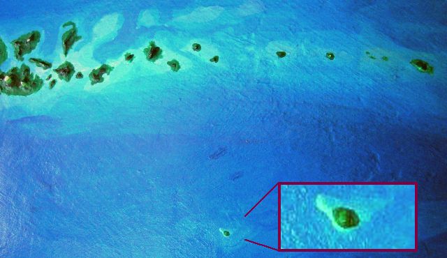 High orbital photo of a lone volcanic islet far south of the Oronesia chain.