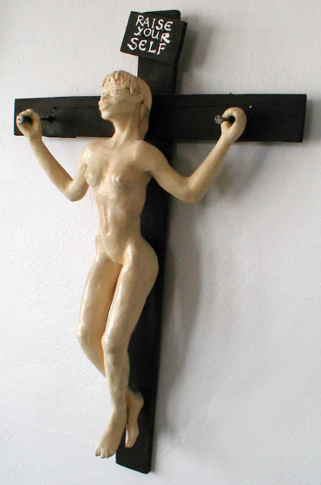 apparently crucified girl raising herself up off the cross. Sculpture by Wayan. Click to enlarge.