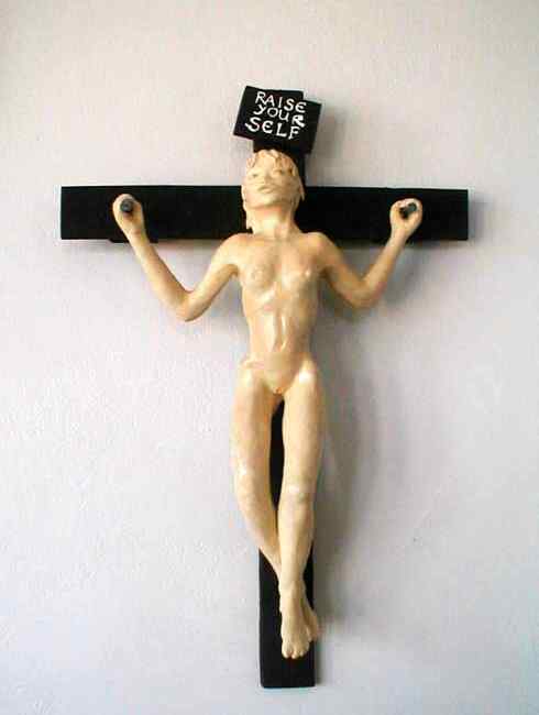 Front view, girl on a cross that says RAISE YOURSELF! Sculpture by Wayan. Click to enlarge.
