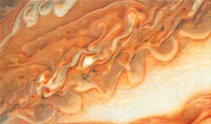 Laminar flow on the face of Jupiter--orange and cream swirls.