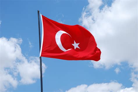 Turkish flag: white crescent and star on red.