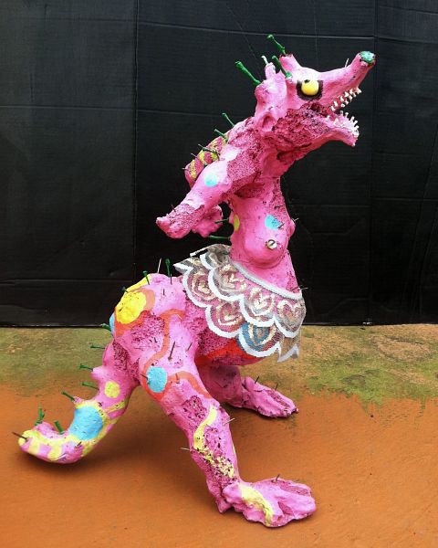 Statue by Varitz, 'Portrait of Mom': pink dino in a tutu, bristling with nails. Click to enlarge